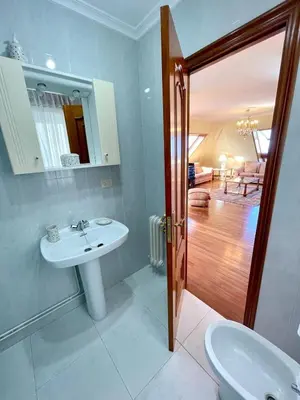 a bathroom with a sink and a mirror at The Cliffs - Milamarina in Viveiro