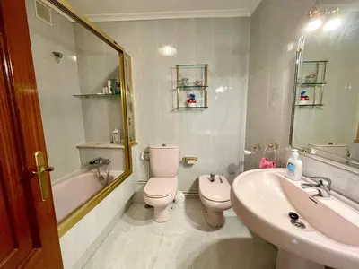 a bathroom with a sink and a toilet and a bath tub at The Cliffs - Milamarina in Viveiro