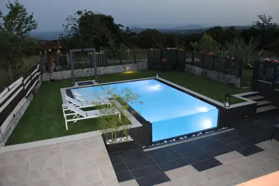 a swimming pool in the middle of a yard at CASA VACACIONAL ACIO in Ourense
