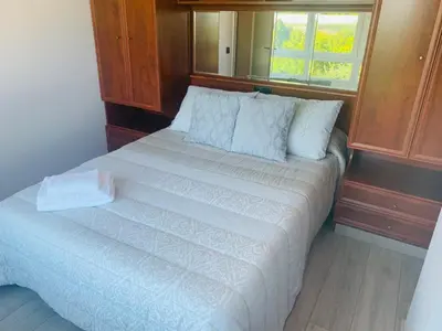 a large bed in a room with a window at lucushouse III in Lugo