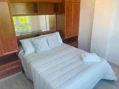 a bedroom with a large white bed with a window at lucushouse III in Lugo