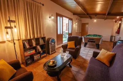 a room with a pool table and a dart board at Casa Visita Ribeira Sacra in Chantada