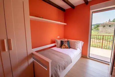 a living room with a couch and a table at Casa Visita Ribeira Sacra in Chantada