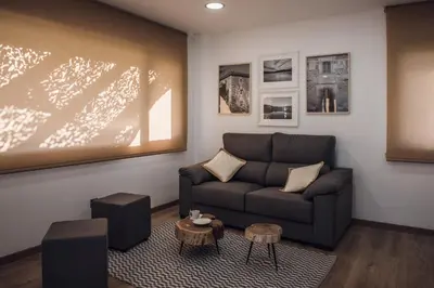 a living room with a couch and a table at Beche EcoCamp in Santa Eulalia