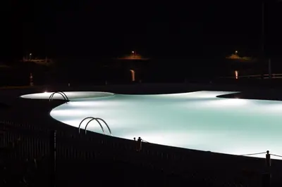 a group of ice hockey rink lit up at night at Beche EcoCamp in Santa Eulalia