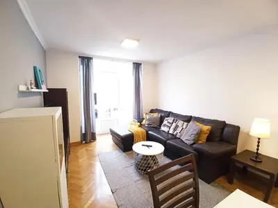 a living room with a couch and a table at Viveiro Muralla in Viveiro