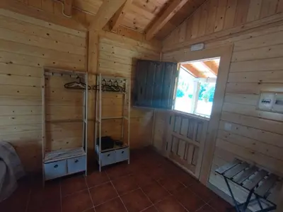 an inside view of a log cabin with a sauna at CAMPING LA ZARAPICA - Palacios del Sil in Palacios del Sil