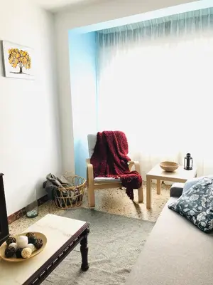 a living room with a couch and a table at Casa CHORIMA in Arzúa