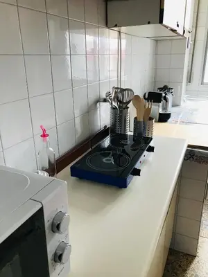 a kitchen counter with a stove top in a kitchen at Casa CHORIMA in Arzúa