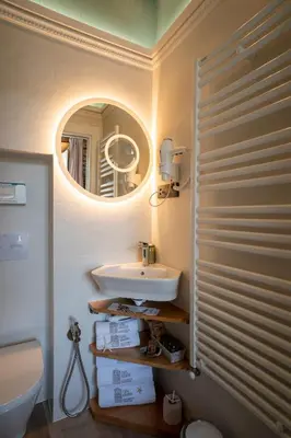 a bathroom with a sink and a mirror at Apartamentos Turísticos Casa Arango in Ribadeo