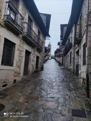 an empty street in an old city with buildings at Casa marina in Puebla de Sanabria