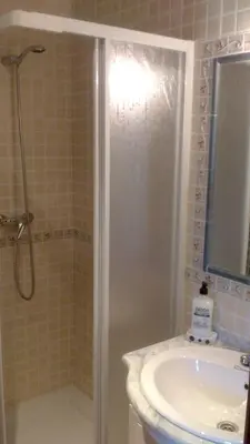 a bathroom with a shower and a sink at Casa Rustica CESAR in Lubián