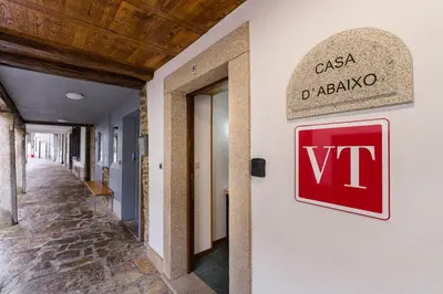 a sign on the side of a building that reads viii at Casa D'Abaixo in Arzúa