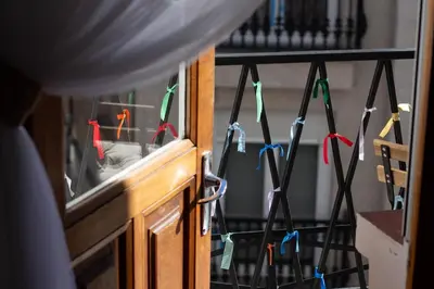 a bunch of ribbonbons are hanging from a wall at a casa da Alicia in Monforte de Lemos