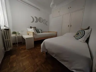 a bedroom with a bed and a couch in it at a casa da Alicia in Monforte de Lemos