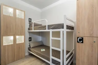 a small room with bunk beds in it at Albergue Alda Pilgrim Ponferrada in Ponferrada