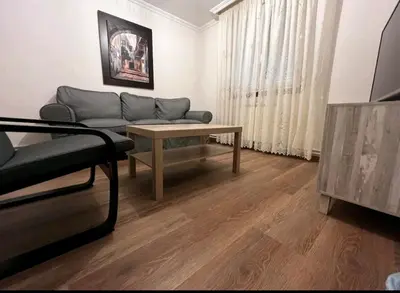 a living room with a couch and a table at Castiñeiras Street in Sarria
