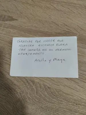 a piece of paper with writing on it on a table at Castiñeiras Street in Sarria