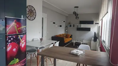 a living room with a table and a dining room at Foz Playas in Foz