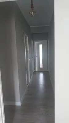 an empty room with a hallway with white walls and a ceiling at Foz Playas in Foz