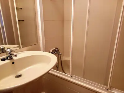 a bathroom with a shower and a sink at Ático Pilos in Castro Caldelas