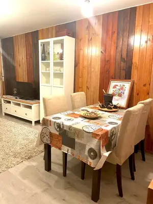 a dining room with a table with chairs and a painting at Casa Concha do Caserón do Viaxeiro in Mondoñedo