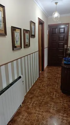 a room with a hallway with a door and a tile floor at LA CAMELIA in Pontevedra