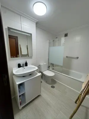 a bathroom with a sink and a toilet and a shower at Apartamento a 5 minutos del casco histórico in Viveiro