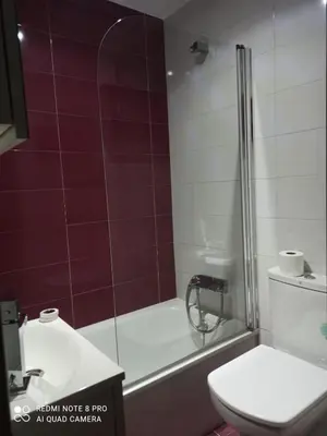 a bathroom with a shower and a toilet and a sink at Aroalia, super céntrico!! in Ourense