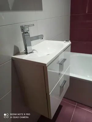 a bathroom with a white sink and a mirror at Aroalia, super céntrico!! in Ourense