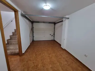 an empty room with a hallway with stairs and a closet at Apartamento en Playa Rapadoira in Foz