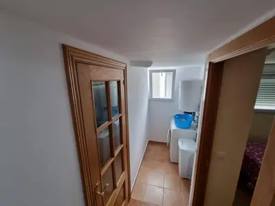 a bathroom with a toilet and a sink at Apartamento en Playa Rapadoira in Foz