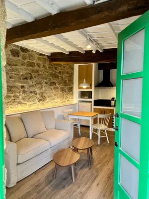 a living room with a couch and a table at A Parada House by Kev in Parada del Sil