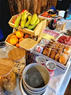 a table topped with baskets of fruit and other foods at Fogar de Breogán in Pontevedra