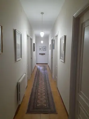 a long hallway with white walls and a rug at Casa de Alicia Pontevedra Moraña Rías Baixas Casa Entera VT-PO-OOOO32 in Moraña