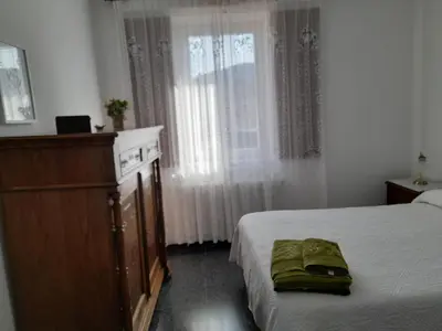 a bedroom with a bed and a dresser and a window at Casa de Alicia Pontevedra Moraña Rías Baixas Casa Entera VT-PO-OOOO32 in Moraña