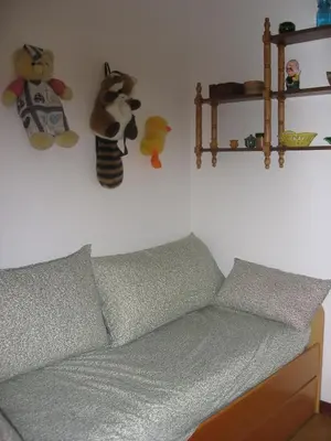 a couch in a room with stuffed animals on the wall at Casa de Alicia Pontevedra Moraña Rías Baixas Casa Entera VT-PO-OOOO32 in Moraña