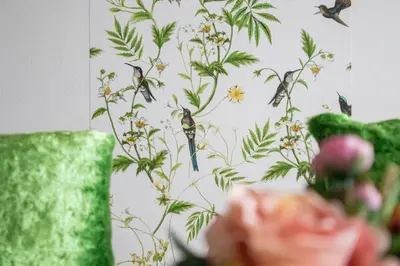 a wallpaper with birds and flowers on a wall at Luxury Singular Apartments Green in Santiago de Compostela