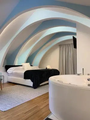 a bedroom with a bed and a bath tub at ESPEJO DE SOLEDADES in Vigo de Sanabria
