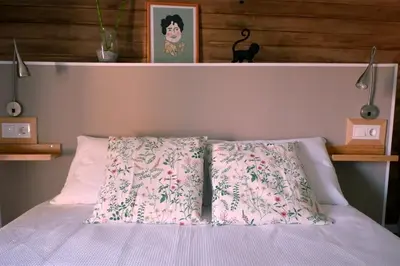 a bedroom with a bed with two pillows on it at A casa da Penela in Sas de Penelas
