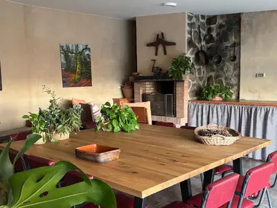a wooden table in a room with plants on it at Casa Santa Ana in Tourón
