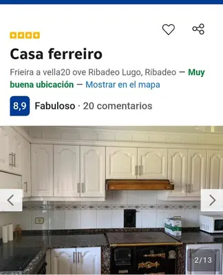 a screenshot of a kitchen with white cabinets at Casa ferreiro in Ribadeo