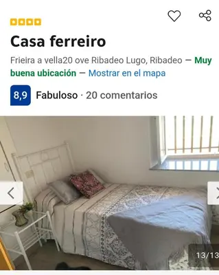 a bedroom with a bed and a window at Casa ferreiro in Ribadeo