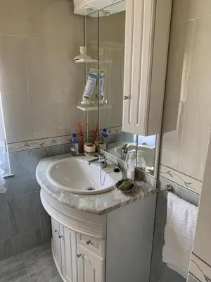 a bathroom with a sink and a mirror at Casa ferreiro in Ribadeo