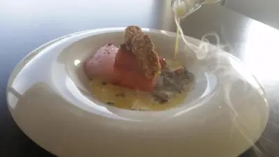 a white plate with a piece of food on it at HOTEL RST. PADORNELO in Padornelo