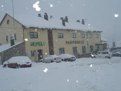 a group of cars parked in a parking lot in the snow at HOTEL RST. PADORNELO in Padornelo