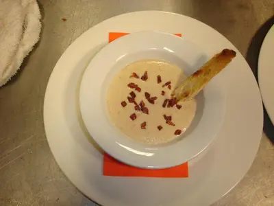 a bowl of soup with a cinnamon stick in it at HOTEL RST. PADORNELO in Padornelo