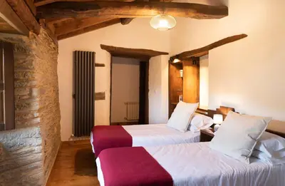 a bedroom with two beds in a room at Casa Liñeiras in Lugo