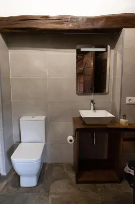 a bathroom with a toilet and a sink at Casa Liñeiras in Lugo