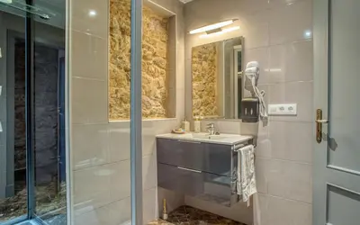 a bathroom with a sink and a shower at CASA DO LEAL SILVER WAY in Silleda
